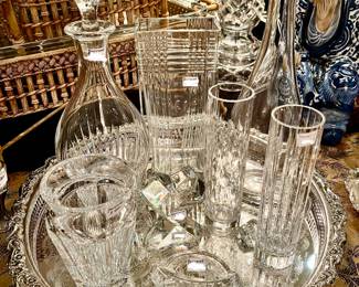 Silver tray full of Baccarat crystal.