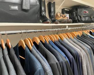 Nice walk-in closet full of superb suits.