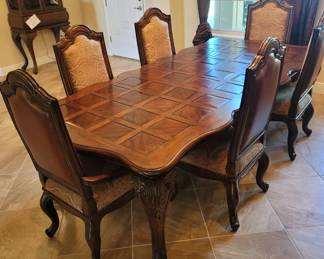 Marge Carson Dining set with 2 leaves and 6 tapestry and leather chairs(nearly new condition, used only a few times)