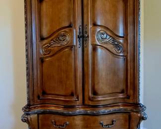 Michael Amini Armoire(bedroom suite) with 2 cedar lined drawers. Has wood insert for back so it can be used as wardrobe or can be used for TV