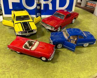 FORD - 1949 coupe, 1957 Thunderbird convertible (Birmingham), 1960s battery operated mustang Mach 1  (Taiyo), 1970 mustang (Ertl), Ford gas pump and Ford decal.