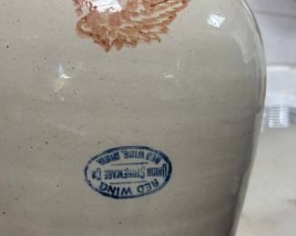 Closer view of the UPSIDE DOWN  oval Redwing blue stamp underneath the wing.