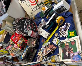 Selection of Green Bay Packer items, trading cards from the 80's & 90's. 1998 Fort Atkinson Police Milwaukee Brewers baseball cards, GB Packer 25' ruler, TIMEX mini pickup truck clock, Dale Earnhardt items including 2 - t-shirts still in their original shaped car package!! and a 'DE#3' clock & more...