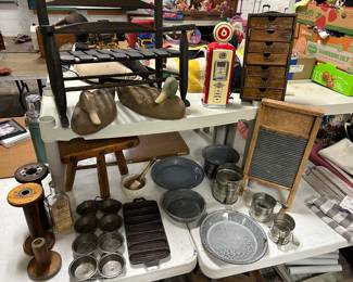 cast iron corn bread mold, decoys, doll rocking, wooden textile Bobbins Spools, Gasoline Mini AM/FM Radio Clock, mortar & pestle set, washboard, flour sifters, and more. Don't forget the 3 legged wood milking stool!!