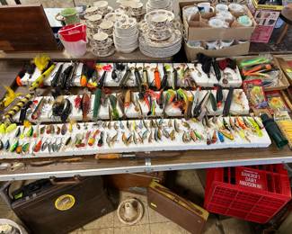 Now... what self-respecting 40++ pounder would not want to strike on some of these great “alluring” lures. Last sale all 300 lures sold. These are all new arrivals (some vintage, some not) with some Heddon & Fred Arbogast and more.... Boat anchor and Plano tackle boxes on the floor right you’ve got a Bancroft Dairy crate from Madison Wisconsin.