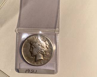 This is a 1921 - P Peace Dollar. The Morgan silver dollar was replaced with the Peace silver dollar in 1921. The Pittman Act of 1918 required the U S mint to start minting silver coins again. 1921 started with the Morgan dollar and then due to the 'want' of a new design promoting PEACE... the Morgan gave way to the Peace dollar. This year of the Peace dollar is a sought after coin for collectors and/or investors.