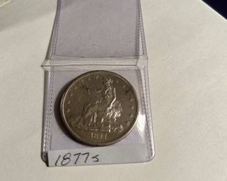 The 1877 S  (micro 's') Trade Dollar. Pease read the info on the next page showing you the 'other side of the dollar. The Trade Dollar was establish to be used to improve trade with the Orient, with emphasis on the China trade. 