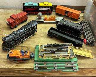 Lionell train set that was wrapped up in a January 1st. 1960 newspaper! Locomotive #2035, #6414 Evans Auto Loader with all four original Lionel vehicles!!  #50 gang car, #3656 Stockyard Transfer unit and five other vintage railroad cars with track.
