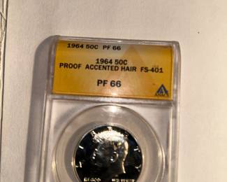 1964 - P Proof 66'Kennedy silver half dollar with accented hair. 