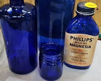 4 VINTAGE BLUE GLASS BOTTLES