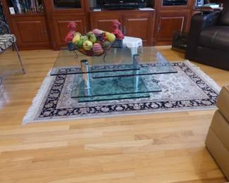 Chrome & glass multi-level coffee table, area rug