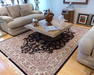 Travertine coffee table, area rug