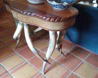 Unique one of a kind wooden table with long horn legs