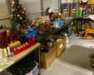 Tons of Christmas. Vintage wooden child's rocking horse under that table.