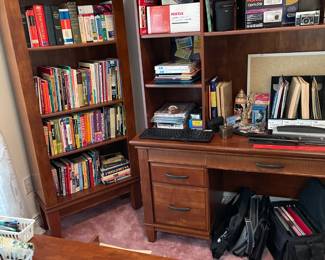 Another part of the book selection.  Vintage ceramic set of medieval chessmen on the desk.