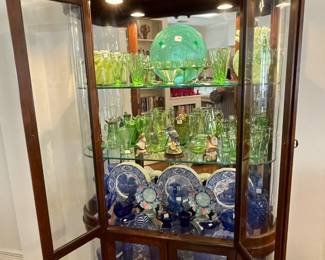 Front opening curved glass lighted curio. Depression glass collection and Fenton.