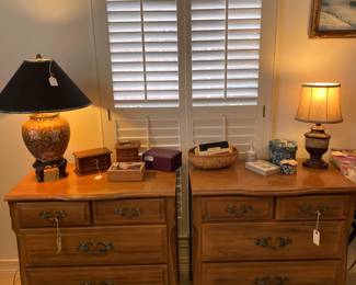 Two four drawer side tables.
