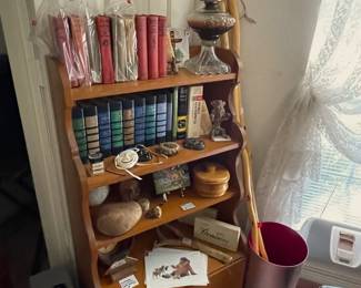 Vintage oil lamp. Collection of vintage original Tarzen book series. Willow stick hiking staffs.