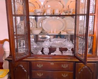 Front opening, beveled glass, lighted china cabinet.