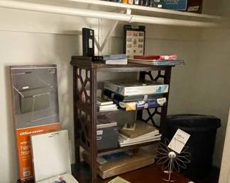 More books and office supplies.  Jade bookends and a set of vintage stereo speakers.