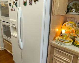 Kenmore side by side refrigerator with ice maker and thru the door access.