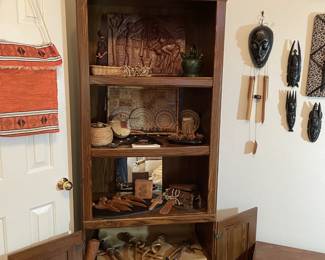 A very rare collection of vintage items, most from the North-west region of Africa. Carved fertility chain, wooden plaque, carved knife/letter openers. Vintage mortar/pestle. 
