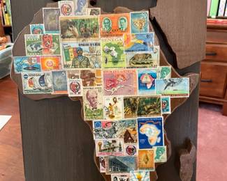  A unique plaque displaying a Senegal African stamp collection.