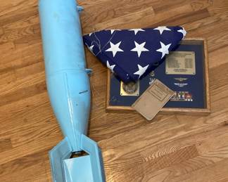 United States Navy Retired With Awards And A Folded Flag In A Frame As Well As A Basic Field Manual Soldiers Handbook