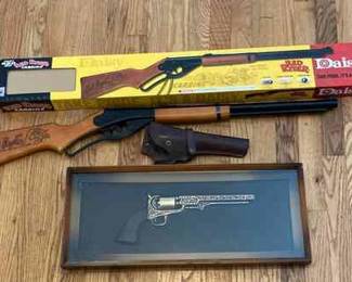 Red Ryder Fake Revolver In Frame With A Real Pistol Holster