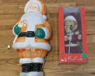 Singing Bing Cosby Santa Figurine And A Santa Clause Decoration That Lights Up