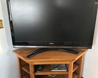 A very nice Toshiba Flat Screen TV with Remote, Paperwork! Also this beautiful Oak Corner TV Stand! Can be purchased together separate!  Buy both together and get a discount! 