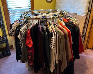 Our woman's clothing department is on the first floor! EXCELLENT clothes, shoes, purses, wallets , and scarves!     This rack is filled with blouses, shirts, jackets, coats, pants, and more! MANY are designer pieces and all are in excellent condition!