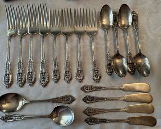 This is a simply beautiful 24 piece Wallace Sterling Silver in the ROSE POINT pattern. Service for four, plus serving pieces! (This pic is 18 pieces)