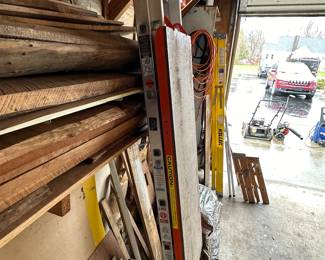 The 2 garages and outbuilding are PACKED! So many tools! Need a ladder, we have them! 