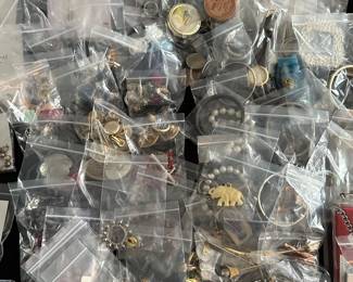 A banquet table filled with beautiful jewelry! Rings, Earrings, Bracelets, Brooches, Necklaces, Watches and MORE! Vintage to new! Sterling, Gold and precious stones! Also a large quantity of religious themed pieces! 