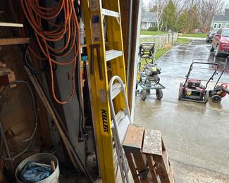 The 2 garages and outbuilding are PACKED! So many tools! Need a ladder, we have them! 