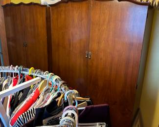 Accompanying our woman's clothing is a pair of BEAUTIFUL matching 1930s/40s mahogany armoires! One small and one large! 