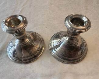 A pair of Sterling candlesticks. 