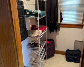 This closet is filled with sweaters, luggage and such! Many of the sweaters are Woolrich! 