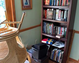 A pair of excellent rattan chairs, and a bookcase filled with EXCELLENT books! Everything from signed first editions, to How To books! Lots of Michigan and Local history! 