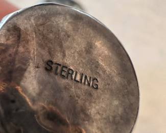 A beautiful Vintage pair of Sterling Silver individual salt shakers. (Thats the reflection of my camera on the bottom)