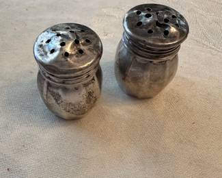 A beautiful Vintage pair of Sterling Silver individual salt shakers.