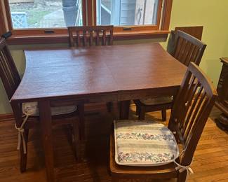 This is a sweet table and four chairs! It comes complete with custom felt tops, and chair cushions! The shape of the table is very cool! 
