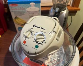 Hiding in the back are not one but TWO smoothly makers! One is near mint in the original box. In the forefront of the pic is a MINT Magic Chef Convection Oven Air Forced Roaster W/Grill. I honestly do not believe this to have ever been used! 