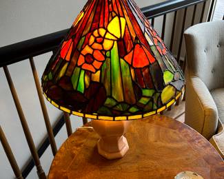 This is probably a marriage of a leaded stained glass lamp shade with a vintage coral ceramic Automax, NY lamp. Shade measures 17" in diameter and 10" high, the lamp is 20 inches approx from base to finial. $150.