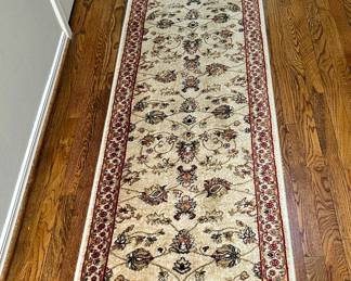 Runner w' pad underneath no label,  measures approx 13' by 27"  wide $65.