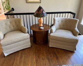 Pair of tufted club chairs upholstered in "ivory diamond" fabric ($150. each) surround a vintage Henredon Heritage inlaid and burled  26" diameter top octagonal wood table with storage (21" height ) $325. Automax NY coral lamp with leaded stained glass shade SOLD