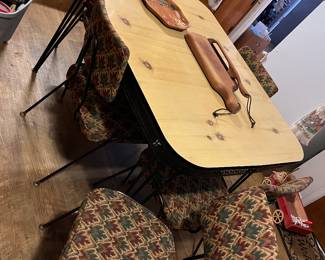 Retro table and 4 chairs.  Excellent condition.  Has been covered with table cloth for years.