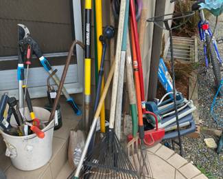 Assortment of Gardening Tools - Rakes, Pitchfork, Shovels
