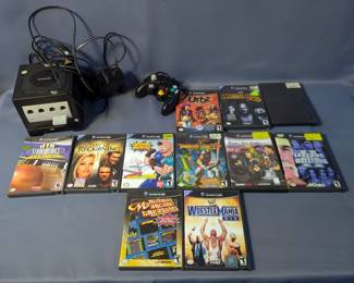 Nintendo Game Cube Video Game Console With Controller, Cables, And Games Including WWE Legends Of Wrestling 1 & 2, WrestleMania x8, Urbz Sims In The City, Dragon's Lair 3D, And More